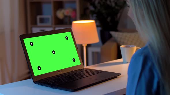 Woman Has Video Call on Laptop with Green Screen 10