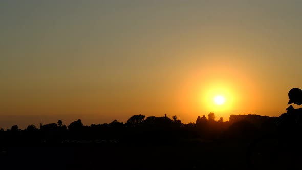 Man Riding Bike Sunset