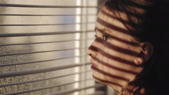 Portrait of a Pretty Girl Looking Out the Window