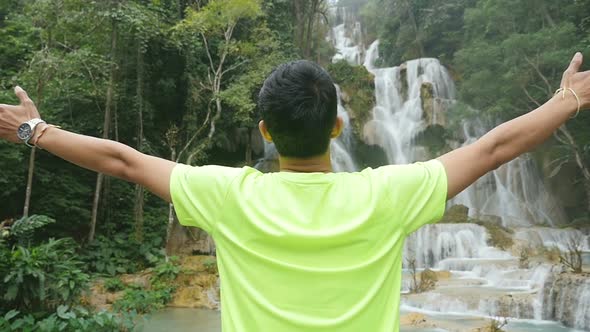 Man Cheerful With Waterfall