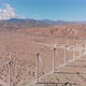 Clean Energy Windmill Farm in the Desert of California with Mountains - VideoHive Item for Sale
