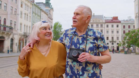 Elderly Old Couple Grandmother Grandfather Tourists Traveling on City Street Life After Retirement