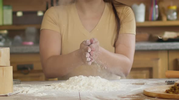 Slow Motion Close-up Woman's Hands Clapping with Flour While Cooking Dough