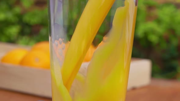 Delicious Orange Juice Is Poured in a Jug Next To the Box Full of Ripe Oranges