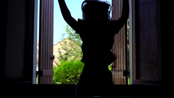 Girl Jumping on the Bed