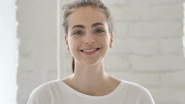 Smiling Young Woman in Office