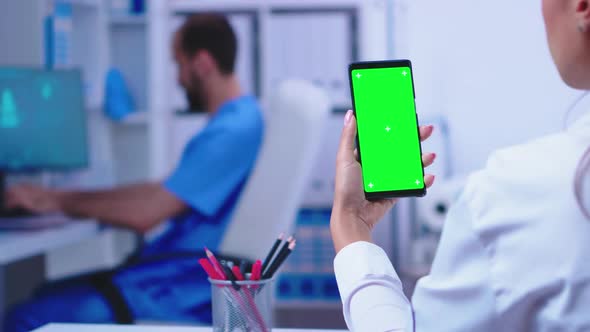 Medical Physician Holding Smartphone with Mockup