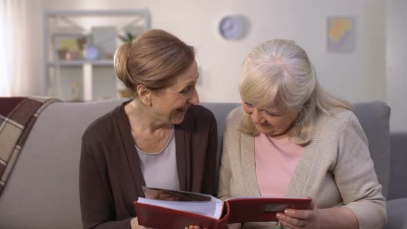 Elderly Women Looking Through Old Photos in Family Album, Pleasure Memories