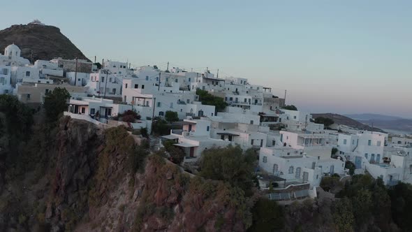 Aerial Perspective Over Typically Greek Village Small Town on Island in Sunset Golden Hour Light