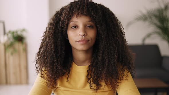 Head Shot Smiling Young African Woman Looking at Camera During Video Call