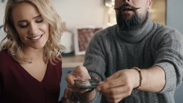 Couple making photos of Christmas decorations. Shot with RED helium camera in 8K