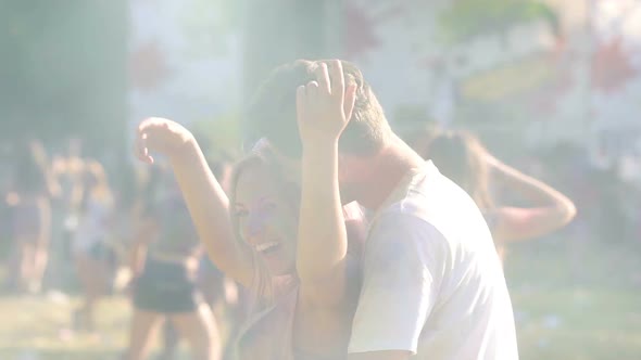 Two Lovers Dancing, Young Happy Couple Covered in Colorful Powder at Holi Fest