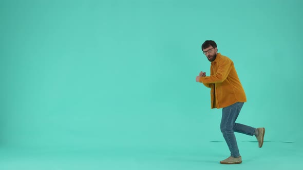 Expressive Man Running While Being Late for Sale