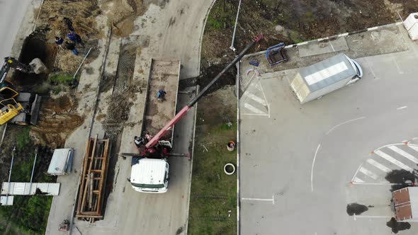 Aerial view of the repair road. Pipe laying, view from height.