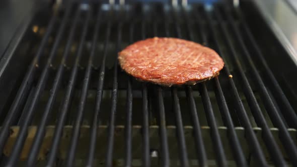 Grilled burger cutlet beef minced meat patties. Cooking beef and pork patty for burger.