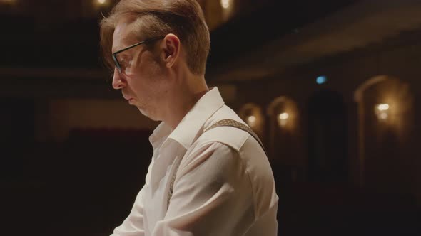 Pianist Performing Music on Grand Piano