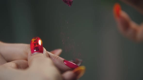 Doing Manicure - Applying Sparkles on the Pink Nail with a Small Flat Brush