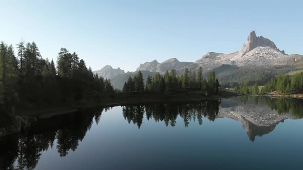 Aerial Flying over Mountain Lake Federa in Dolomites Alps Italy