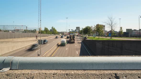 Highway traffic time lapseing under bridge intersection, slider view