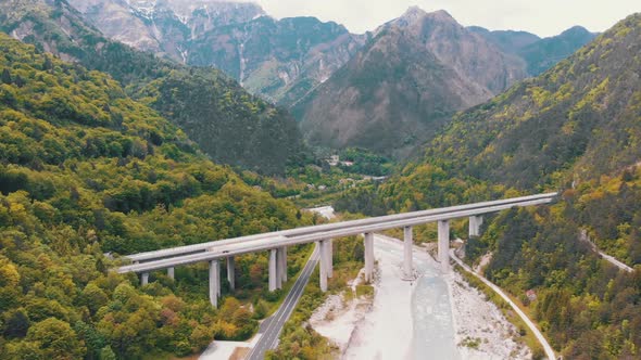 Aerial View of the Concrete Highway Viaduct on Concrete Pillars in the Mountains