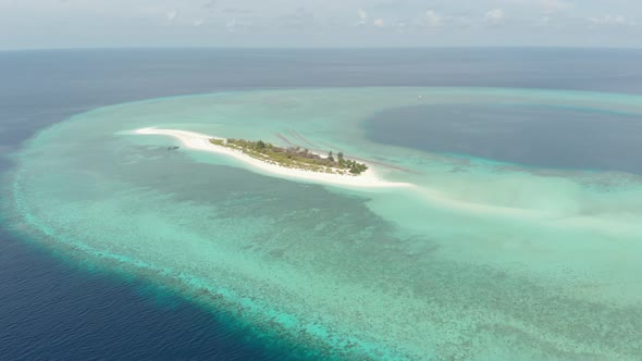 Aerial: Flying over idyllic atoll, Wakatobi Marine National Park Indonesia