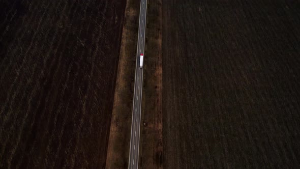 The White Track Goes on Highway Off Into the Distance to the Horizon