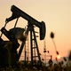 pumpjack at an oil drilling site and sunset - VideoHive Item for Sale
