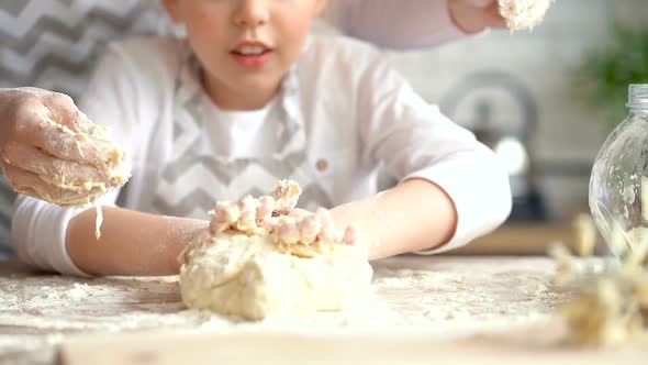 Mother and Her Pretty Daughter Cooking Together