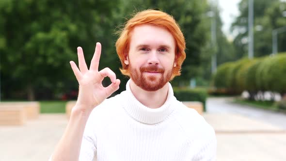 Okay Sign by Man with Red Hairs, Outdoor