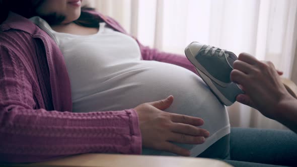 Pregnant Couple Feels Love and Relax at Home