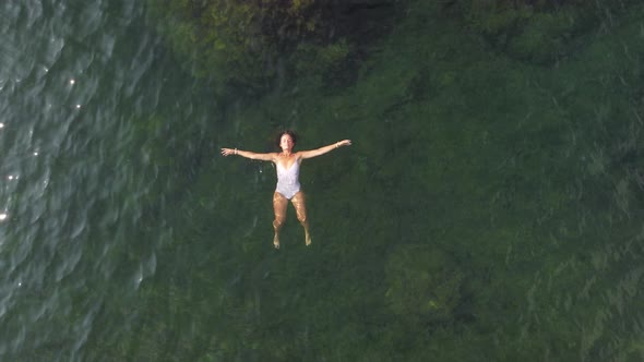 Woman Floating Sea