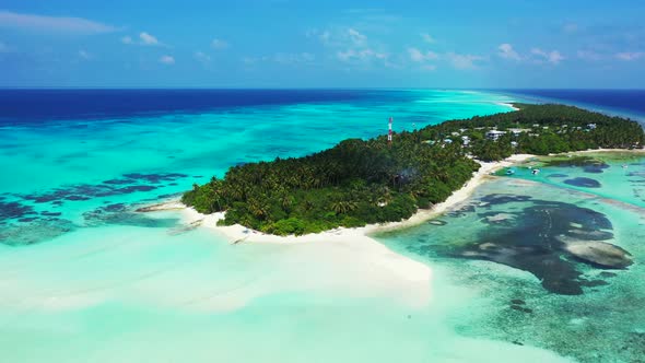 Daytime drone island view of a white sandy paradise beach and turquoise sea background in best quali