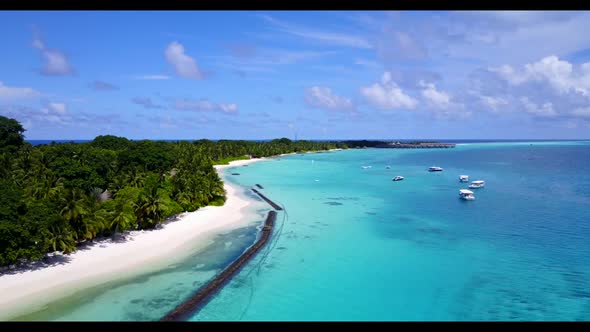 Aerial texture of marine shore beach break by clear ocean and white sand background of a dayout near