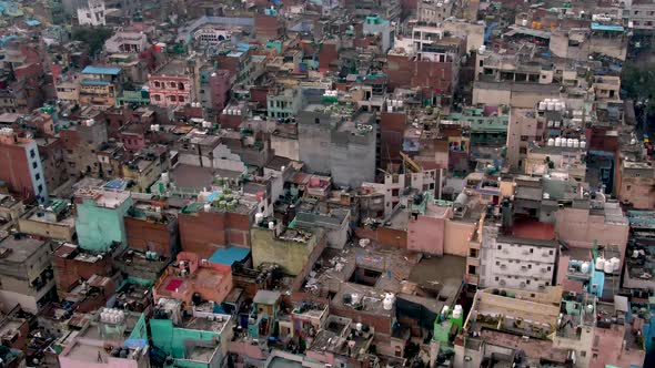 India, Delhi city center slums roofs aerial 4k drone footage, evening dusk