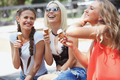 Young women having fun and eating ice cream - PhotoDune Item for Sale