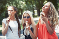 Girlfriends having fun and eating ice cream - PhotoDune Item for Sale