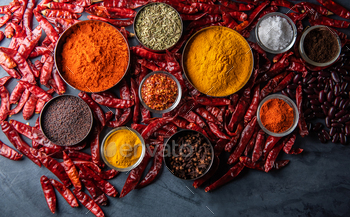 Variety of spices and herbs on kitchen table / Photodune, Misc
