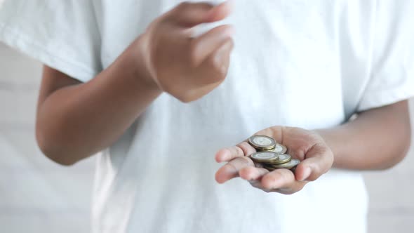 Close Up of Man Hand Counting Coins