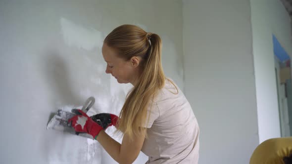 A Young Man and Woman are Doing Walls Renovation in Their House