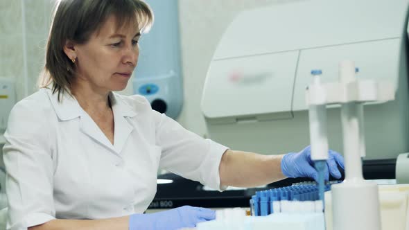 Female Medical Specialist Is Working with Biological Probes