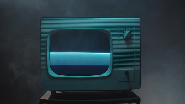 Old Vintage Television on Black Background with Smoke