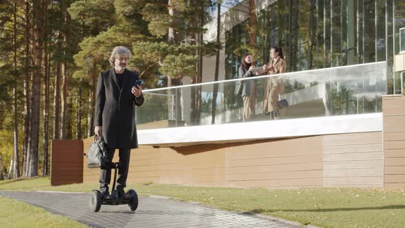 Man Riding Gyroscooter Outside In Daylight