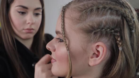 Side View of Make Up Artist Work with Beautiful Blond Hair Model