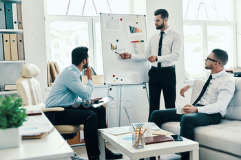 alwear conducting a business presentation using flipchart while working in the office