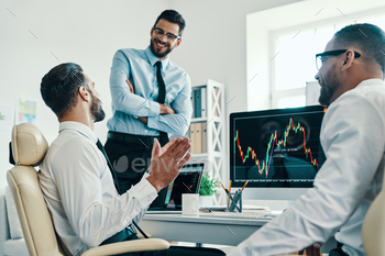 n in formalwear analyzing stock market data while working in the office