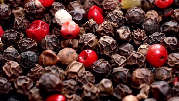 Pile of Mixed Dried Multicolored Peppercorns Spices Rotating Slowly