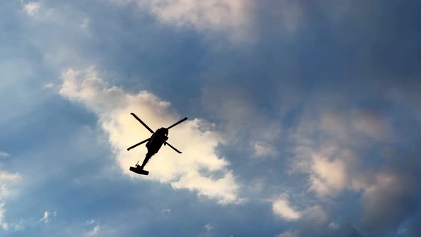 Helicopter Is Passing On Cloudy Sunset Sky 2