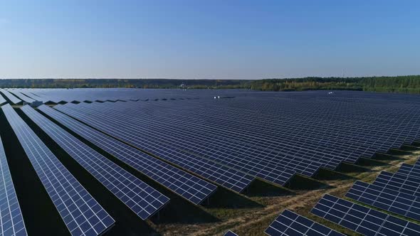 Aerial Drone Footage. Flight Over Solar Panel Farm. Renewable Green Alternative Energy