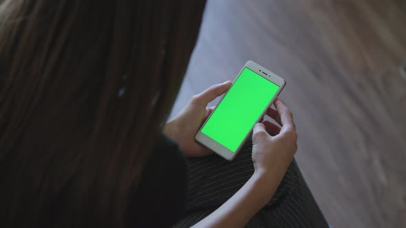 Excited Girl Playing Video Games on smartphone.Green Screen Hromakey