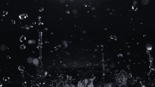 4K 30fps, Pouring water into puddle, Slow Motion